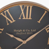 Antique Gold and Black Metal Wall Clock