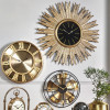 Gold Metal and Black Face Starburst Wall Clock